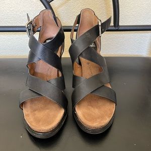 Lightly worn leather black sandals